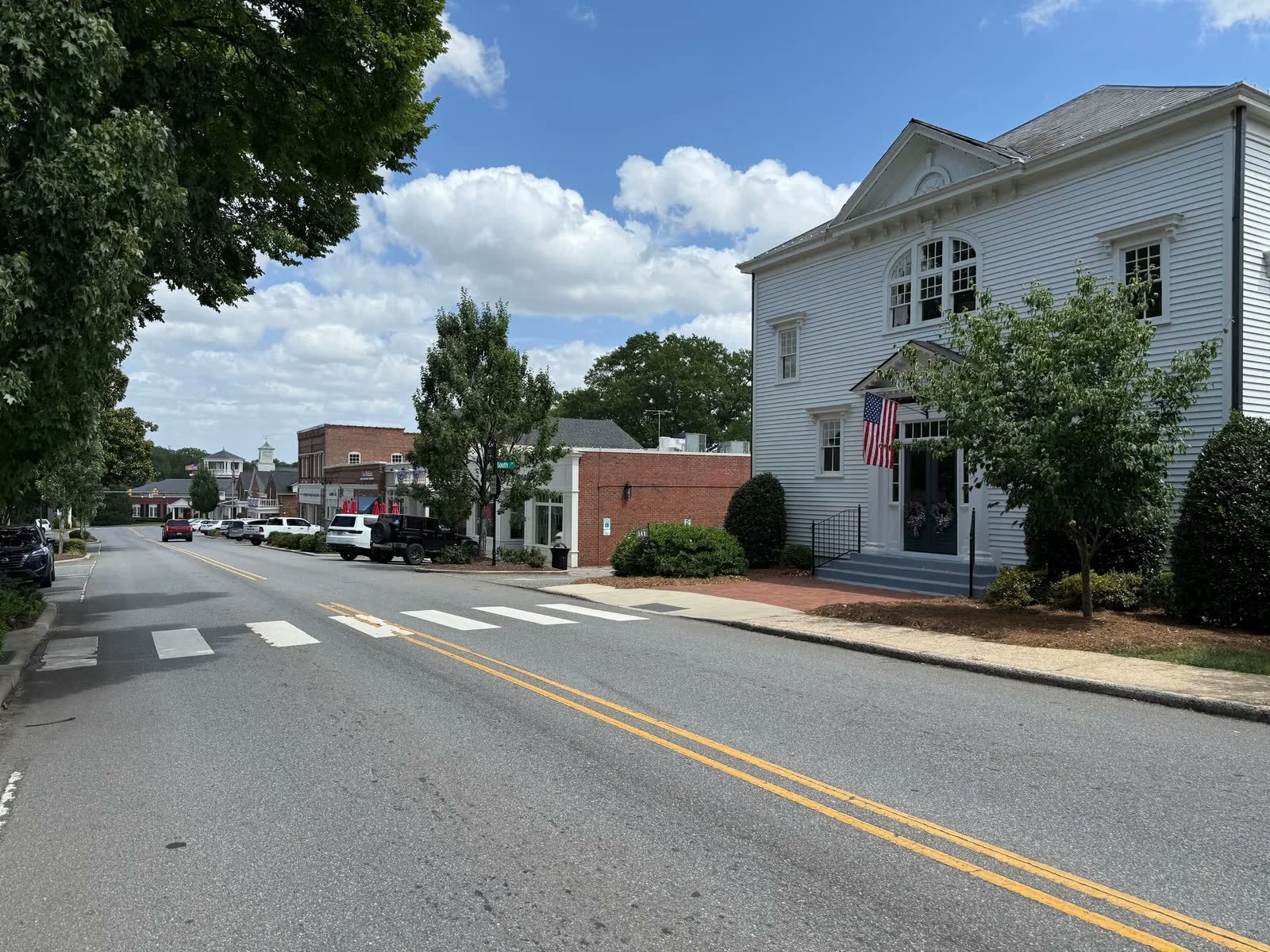 Main Street storefronts including La Delizia and Terra Mia in McAdenville, NC